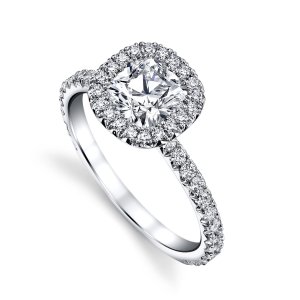 Cushion-cut diamond engagement ring with halo and pavé-set shoulders in 14K white gold.