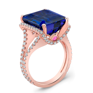 Tanzanite ring in rose gold with pink sapphire accents, diamond pavé split shank, and a large U-shaped under halo.